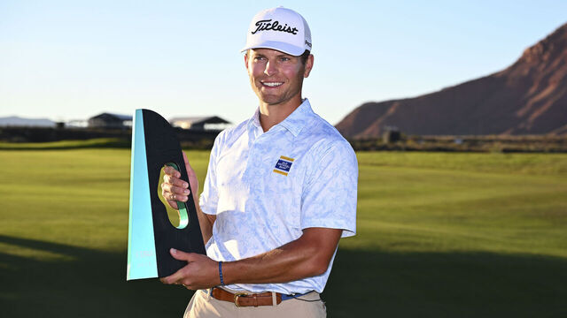 IVANS, UTAH - OCTOBER 26: Michael Brennan poses with the trophy after winning the Bank of Utah Championship at Black Desert Resort on October 26, 2025 in Ivans, Utah.