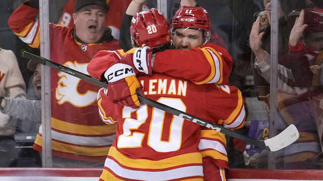 CALGARY, CANADA - OCTOBER 26: Blake Coleman #20 of the Calgary Flames celebrates his third period goal on the New York Rangers with Mikael Backlund #11 of the Calgary Flames at the Scotiabank Saddledome on October 26, 2025, in Calgary, Alberta, Canada.