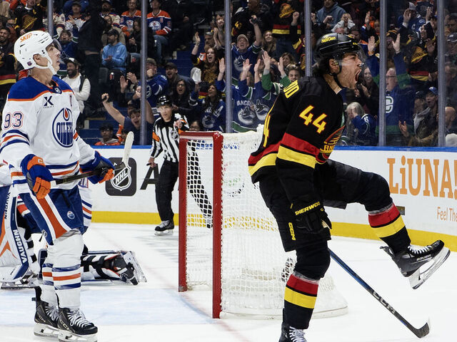 VANCOUVER, CANADA - OCTOBER 26: Ryan Nugent-Hopkins looks on as Kiefer Sherwood #44 of the Vancouver Canucks celebrates after scoring on Calvin Pickard #30 in overtime during their NHL game at Rogers Arena on October 26, 2025 in Vancouver, British Columbia, Canada.