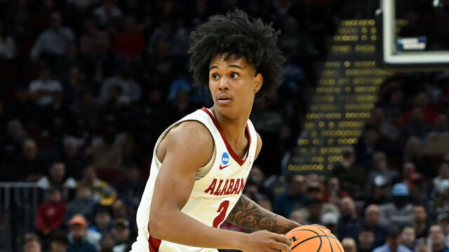 CLEVELAND, OHIO - MARCH 21: Aden Holloway #2 of the Alabama Crimson Tide dribbles down the court during the second half against the Robert Morris Colonials in the first round of the NCAA Men's Basketball Tournament at Rocket Arena on March 21, 2025 in Cleveland, Ohio.