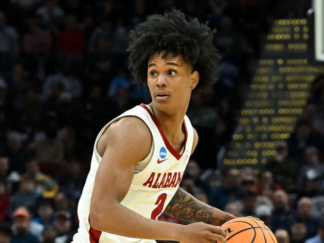 CLEVELAND, OHIO - MARCH 21: Aden Holloway #2 of the Alabama Crimson Tide dribbles down the court during the second half against the Robert Morris Colonials in the first round of the NCAA Men's Basketball Tournament at Rocket Arena on March 21, 2025 in Cleveland, Ohio.