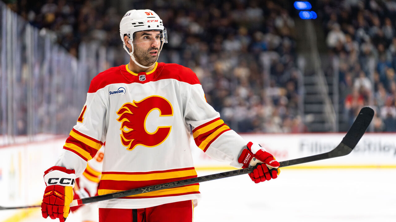 WINNIPEG, CANADA - OCTOBER 24: Nazem Kadri #91 of the Calgary Flames prepares for a face-off in the third period against the Winnipeg Jets at Canada Life Centre on October 24, 2025 in Winnipeg, Canada.