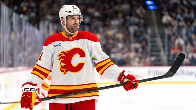 WINNIPEG, CANADA - OCTOBER 24: Nazem Kadri #91 of the Calgary Flames prepares for a face-off in the third period against the Winnipeg Jets at Canada Life Centre on October 24, 2025 in Winnipeg, Canada.
