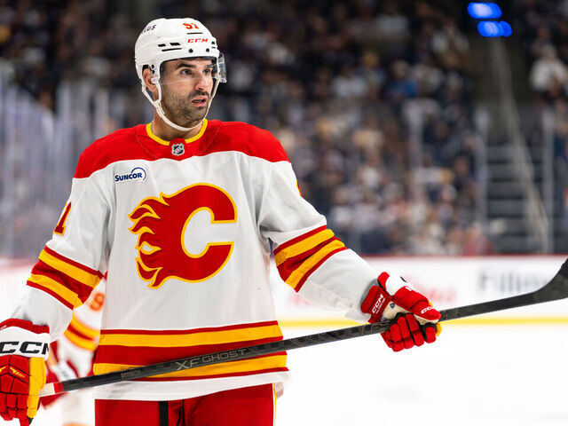 WINNIPEG, CANADA - OCTOBER 24: Nazem Kadri #91 of the Calgary Flames prepares for a face-off in the third period against the Winnipeg Jets at Canada Life Centre on October 24, 2025 in Winnipeg, Canada.