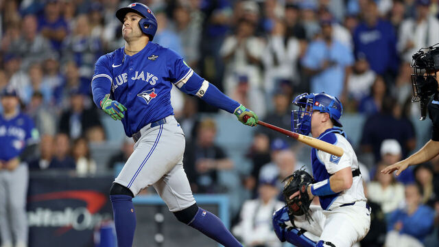 LOS ANGELES, CALIFORNIA - OCTOBER 27: George Springer #4 of the Toronto Blue Jays strikes out during the fourth inning against the Los Angeles Dodgers in game three of the 2025 World Series at Dodger Stadium on October 27, 2025 in Los Angeles, California.