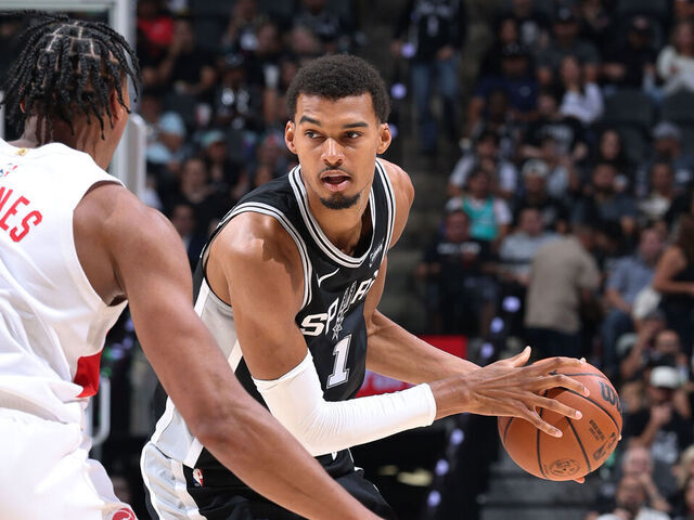 SAN ANTONIO, TX - OCTOBER 27: Victor Wembanyama #1 of the San Antonio Spurs looks to pass the ball during the game against the Toronto Raptors on October 27, 2025 at the Frost Bank Center in San Antonio, Texas. Mandatory Copyright Notice: Copyright 2025 NBAE (Photos by Jeff Haynes/NBAE via Getty Images)
