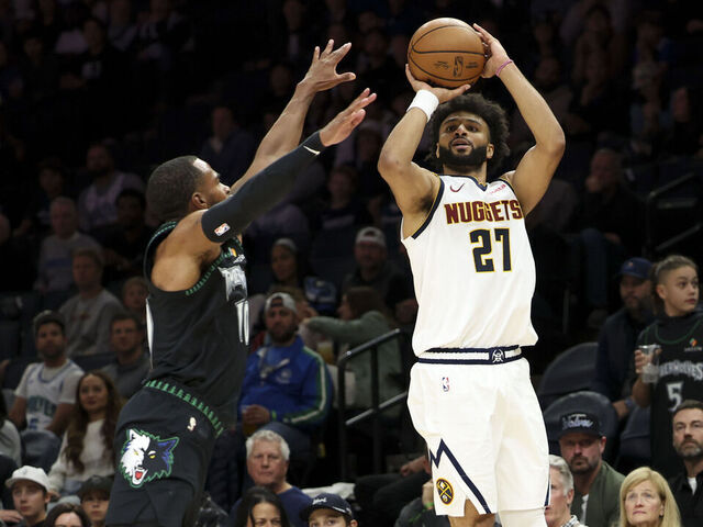MINNEAPOLIS, MINNESOTA - OCTOBER 27: Jamal Murray #27 of the Denver Nuggets shoots against Mike Conley #10 of the Minnesota Timberwolves during the third quarter at Target Center on October 27, 2025 in Minneapolis, Minnesota.
