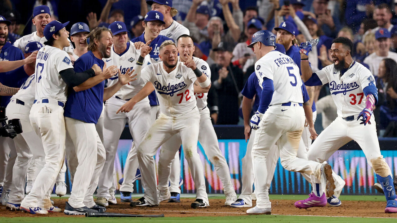 Los Angeles, CA October 27, 2025: Los Angeles Dodgers first baseman Freddie Freeman (5), right, joins his teammate to celebrate his walk off home run in the 18th inning during game three of the World Series between the Los Angeles Dodgers and the Toronto Blue Jays at Dodger Stadium on Monday, October 27, 2025 in Los Angeles, CA.(Eric Thayer / Los Angeles Times via Getty Images)