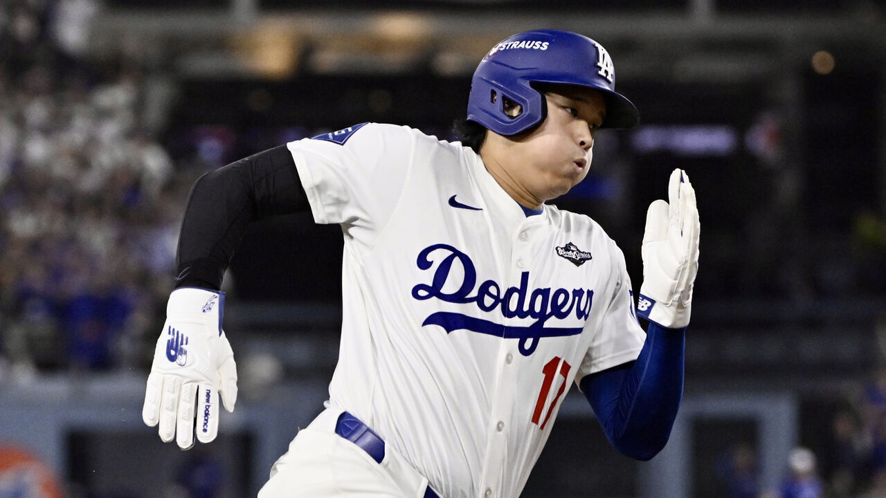 Los Angeles, CA - October 27: Shohei Ohtani #17 of the Los Angeles Dodgers rounds third base and scores on a single by teammate Freddie Freeman (not pictured) against the Toronto Blue Jays in the fifth inning of game 3 of a World Series baseball game at Dodger Stadium in Los Angeles on Monday, October 27, 2025.
