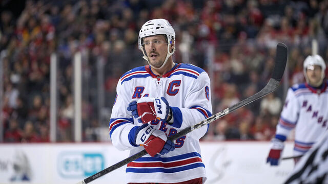 CALGARY, CANADA - OCTOBER 26: J.T. Miller #8 of the New York Rangers skates during a break in play against the Calgary Flames at the Scotiabank Saddledome on October 26, 2025, in Calgary, Alberta, Canada.