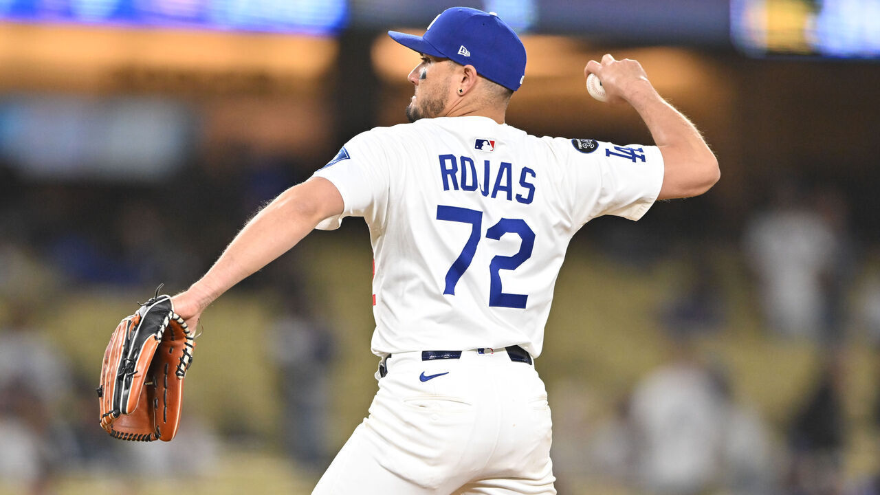 LOS ANGELES, CA - MAY 13: Los Angeles Dodgers shortstop Miguel Rojas (72) pitches from the mound in the ninth inning during the game between Oakland Athletics and the Los Angeles Dodgers on May 13, 2025, at Dodger Stadium in Los Angeles, CA.