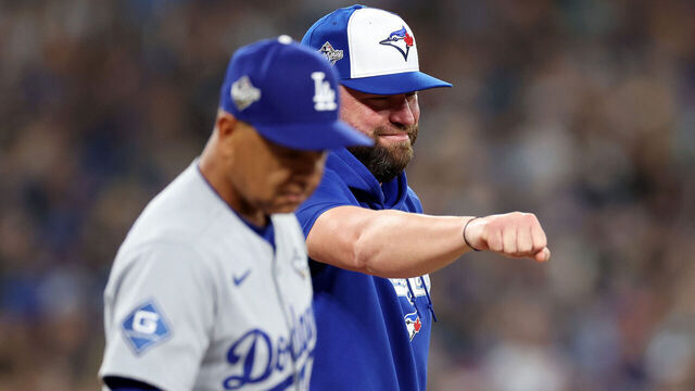 TORONTO, ONTARIO - OCTOBER 24: Managers John Schneider #14 of the Toronto Blue Jays and Dave Roberts #30 of the Los Angeles Dodgers look on before game one of the 2025 World Series at Rogers Center on October 24, 2025 in Toronto, Ontario.