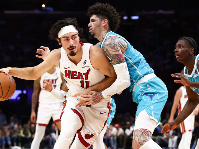 MIAMI, FLORIDA - OCTOBER 28: Jaime Jaquez Jr. #11 of the Miami Heat dribbles the ball to the basket against LaMelo Ball #1 of the Charlotte Hornets during the first quarter of the game at Kaseya Center on October 28, 2025 in Miami, Florida.
