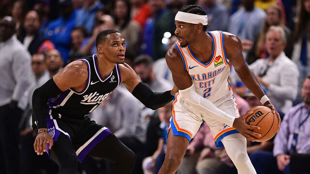 OKLAHOMA CITY, OKLAHOMA - OCTOBER 28: Shai Gilgeous-Alexander #2 of the Oklahoma City Thunder looks for an opening against Russell Westbrook #18 of the Sacramento Kings during the second half at Paycom Center on October 28, 2025 in Oklahoma City, Oklahoma.