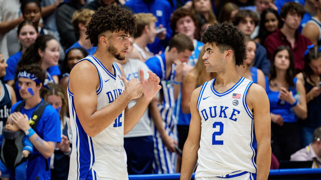 DURHAM, NORTH CAROLINA - OCTOBER 21: (L-R) Cameron Boozer #12 talks with Cayden Boozer #2 of the Duke Blue Devils before their game against the UCF Knights at Cameron Indoor Stadium on October 21, 2025 in Durham, North Carolina.