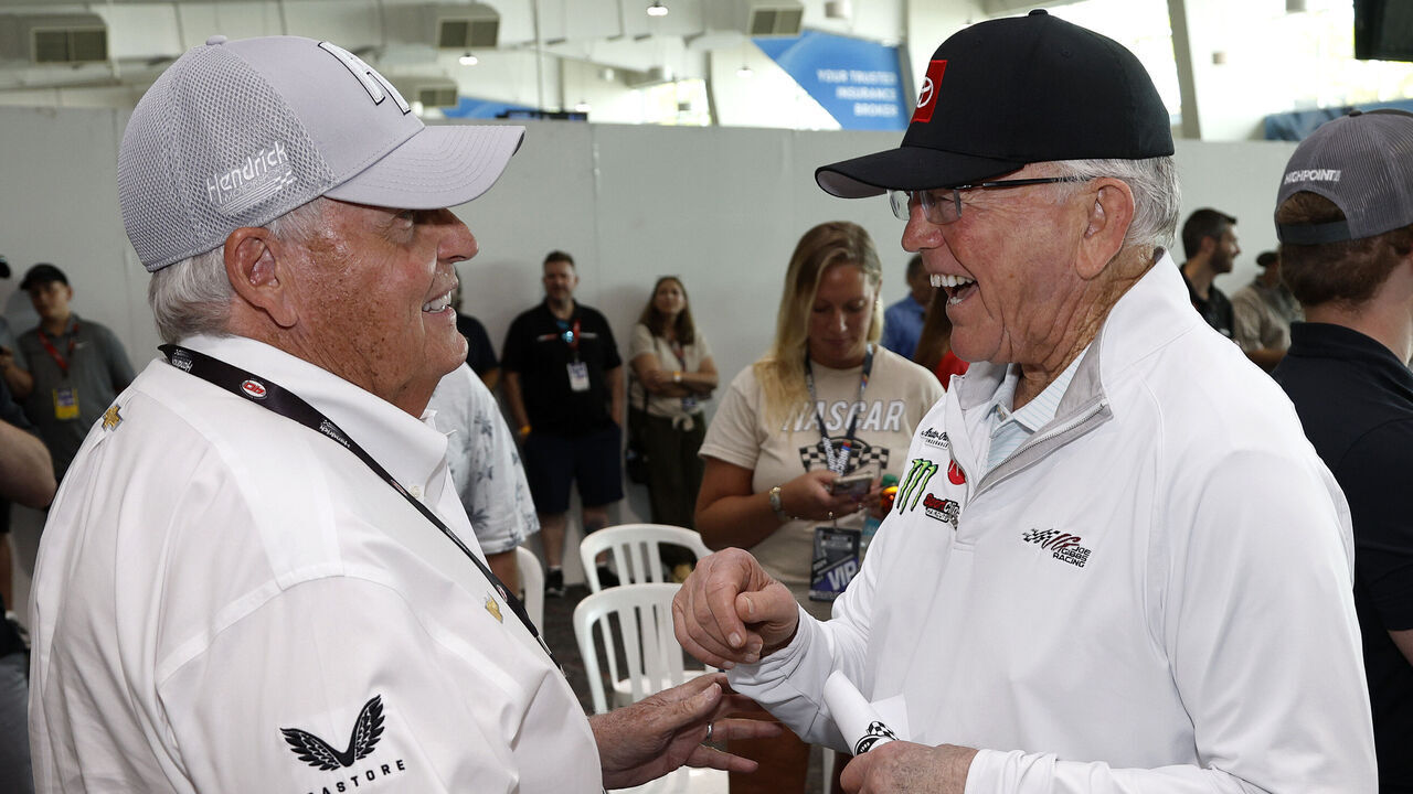 INDIANAPOLIS, INDIANA - JULY 21: NASCAR Hall of Famers JGR team owner, Joe Gibbs (R) and Hendrick Motorsport team owner, Rick Hendrick speak during the drivers meeting prior to the NASCAR Cup Series Brickyard 400 at Indianapolis Motor Speedway on July 21, 2024 in Indianapolis, Indiana.