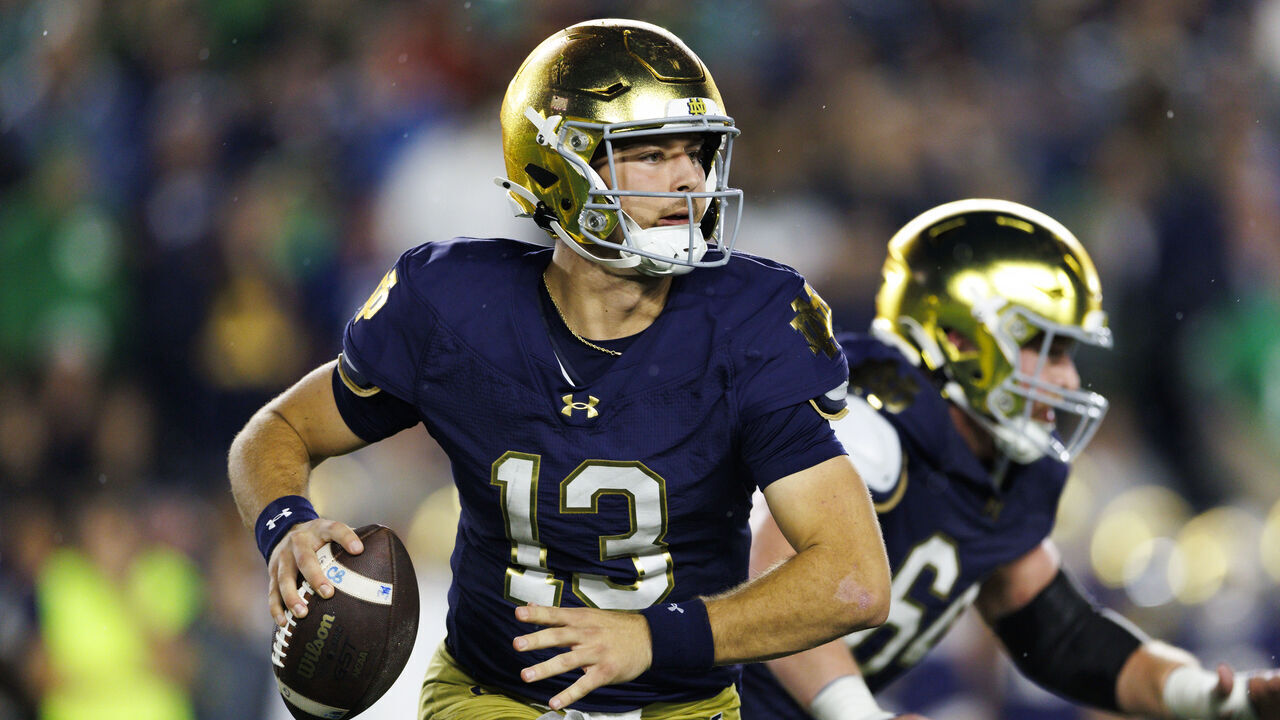 SOUTH BEND, INDIANA - OCTOBER 18: CJ Carr #13 of the Notre Dame Fighting Irish rolls out to pass during the game against USC Trojans at Notre Dame Stadium on October 18, 2025 in South Bend, Indiana.