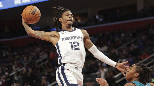 DETROIT, MI - DECEMBER 4: Ja Morant #12 of the Memphis Grizzliesc dunks the ball against the Detroit Pistons on December 4, 2022 at Little Caesars Arena in Detroit, Michigan. NOTE TO USER: User expressly acknowledges and agrees that, by downloading and/or using this photograph, User is consenting to the terms and conditions of the Getty Images License Agreement. Mandatory Copyright Notice: Copyright 2022 NBAE