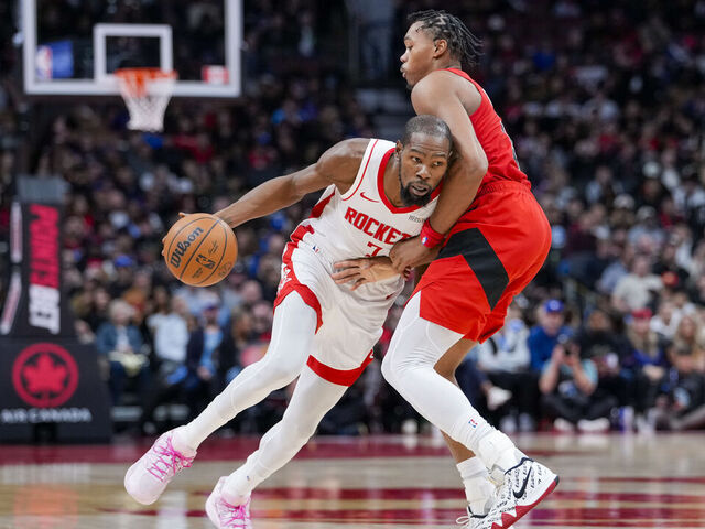 TORONTO, CANADA - OCTOBER 29: Kevin Durant #7 of the Houston Rockets dribbles against Scottie Barnes #4 of the Toronto Raptors during the second half at Scotiabank Arena on October 29, 2025 in Toronto, Canada.