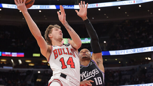 CHICAGO, IL - OCTOBER 29: Matas Buzelis #14 of the Chicago Bulls drives to the basket against Russell Westerbrook #18 of the Sacramento Kings during the first half on October 29, 2025 at the United Center in Chicago, Illinois.