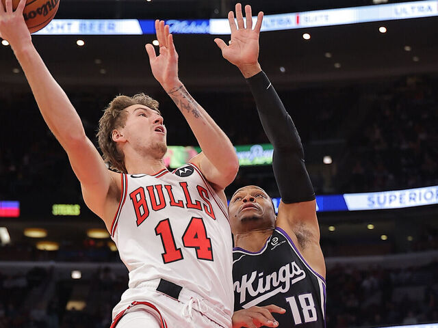 CHICAGO, IL - OCTOBER 29: Matas Buzelis #14 of the Chicago Bulls drives to the basket against Russell Westerbrook #18 of the Sacramento Kings during the first half on October 29, 2025 at the United Center in Chicago, Illinois.