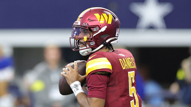 ARLINGTON, TEXAS - OCTOBER 19: Jayden Daniels #5 of the Washington Commanders looks to pass during a game against the Dallas Cowboys at AT&T Stadium on October 19, 2025 in Arlington, Texas.