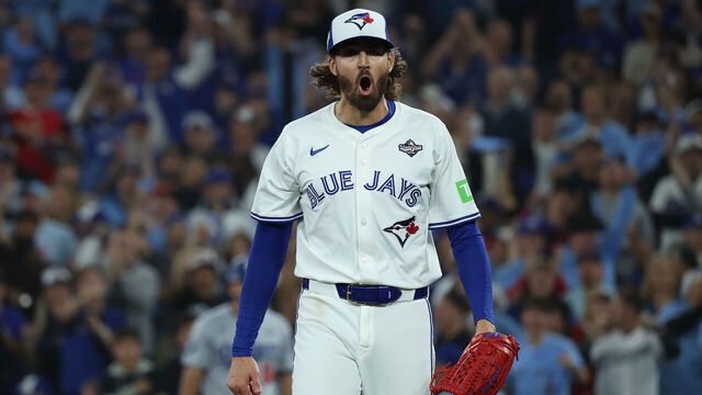 TORONTO, ON - OCTOBER 25 - Toronto Blue Jays pitcher Kevin Gausman (34) yells after pitching a clean inning as the Toronto Blue Jays and the Los Angeles Dodgers play game two of the MLB World Series at Rogers Centre in Toronto. October 25, 2025.