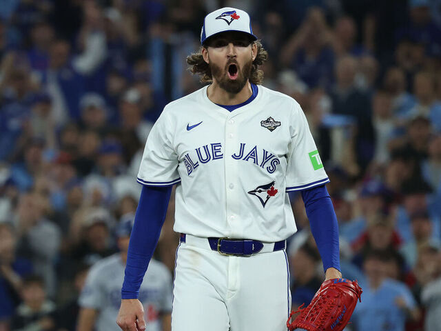 TORONTO, ON - OCTOBER 25 - Toronto Blue Jays pitcher Kevin Gausman (34) yells after pitching a clean inning as the Toronto Blue Jays and the Los Angeles Dodgers play game two of the MLB World Series at Rogers Centre in Toronto. October 25, 2025.