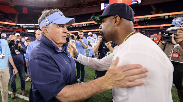SYRACUSE, NEW YORK - OCTOBER 31: (L-R) Head coach Bill Belichick of the North Carolina Tar Heels and head coach Fran Brown of the Syracuse Orange embrace after the game at JMA Wireless Dome on October 31, 2025 in Syracuse, New York.