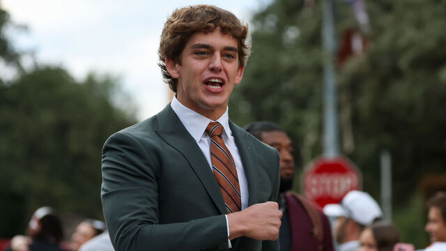 AUSTIN, TX - NOVEMBER 01: Quarterback Arch Manning #16 of the Texas Longhorns pumps his fist and screams "let's go" to fans as he walks into the stadium before the SEC college football between Texas Longhorns and Vanderbilt Commodores on November 1, 2025, at Darrell K Royal-Texas Memorial Stadium in Austin, TX.