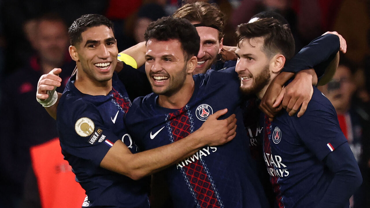 Paris Saint-Germain's Portuguese forward #09 Goncalo Ramos (C) celebrates scoring his team's first goal with Paris Saint-Germain's Moroccan defender #02 Achraf Hakimi (L) and Paris Saint-Germain's Georgian forward #07 Khvicha Kvaratskhelia (R) during the French L1 football match between Paris Saint-Germain (PSG) and OGC Nice at the Parc des Princes stadium in Paris on November 1, 2025.