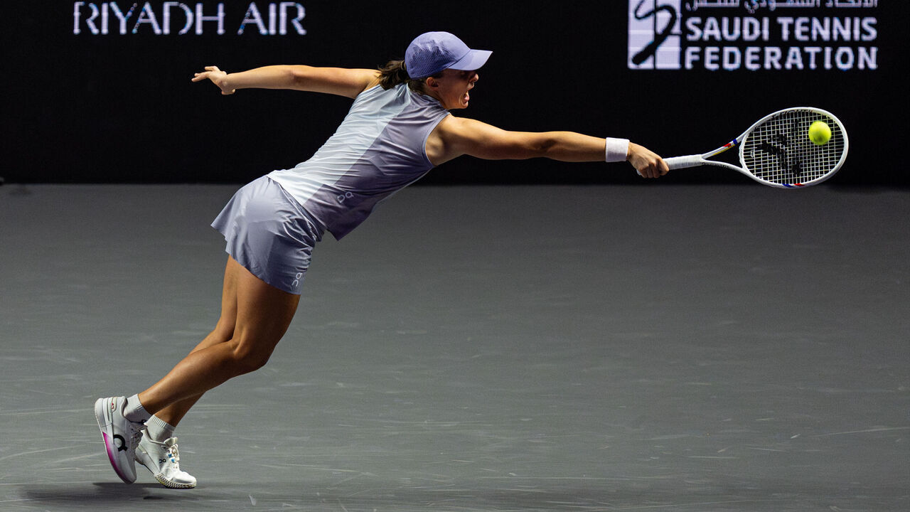 RIYADH, SAUDI ARABIA - NOVEMBER 01: Iga Swiatek of Poland in action against Madison Keys of United States during her round-robin match in the Serena Williams Group at King Saud University Indoor Arena during day one of the WTA Finals Riyadh as part of the Hologic WTA Tour 2025 on November 01, 2025 in Riyadh, Saudi Arabia.
