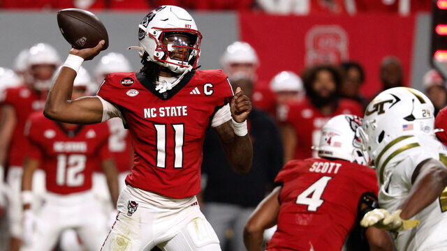 RALEIGH, NORTH CAROLINA - NOVEMBER 1: CJ Bailey #11 of the NC State Wolfpack drops back to pass in the first half against the Georgia Tech Yellow Jackets at Carter-Finley Stadium on November 1, 2025 in Raleigh, North Carolina.