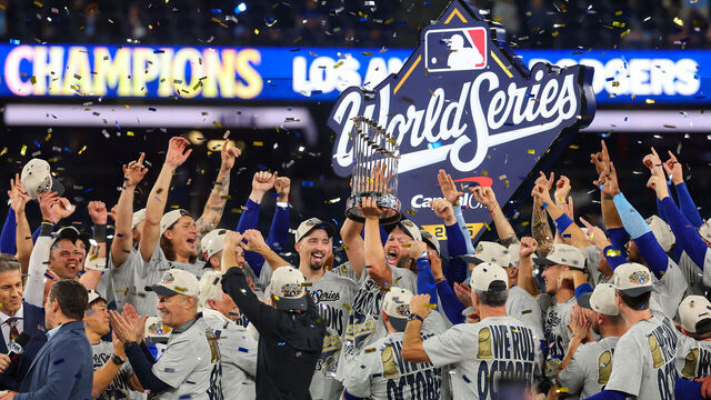 TORONTO, ONTARIO - NOVEMBER 02: Clayton Kershaw #22 of the Los Angeles Dodgers raises the Commisioner's Trophy after defeating the Toronto Blue Jays 5-4 in game seven of the 2025 World Series at Rogers Center on November 02, 2025 in Toronto, Ontario.