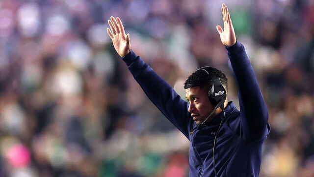 CHESTNUT HILL, MASSACHUSETTS - NOVEMBER 01: Notre Dame Fighting Irish head coach Marcus Freeman celebrates from the sideline during the second half of the game against the Boston College Eagles at Alumni Stadium on November 01, 2025 in Chestnut Hill, Massachusetts. The Fighting Irish defeat the Eagles 25-10.