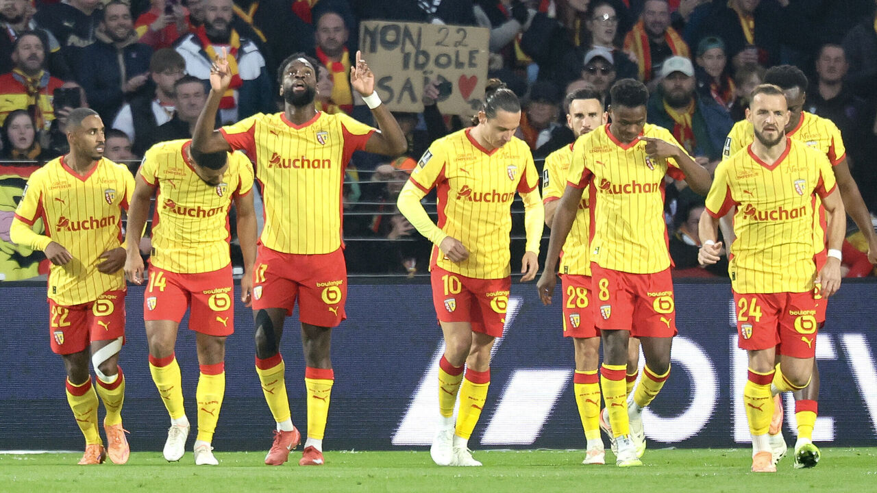 Lens' French forward #11 Odsonne Edouard (C) celebrates scoring the opening goal during the French L1 football match between RC Lens and FC Lorient at the Stade Bollaert-Delelis in Lens, northern France, on November 2, 2025.