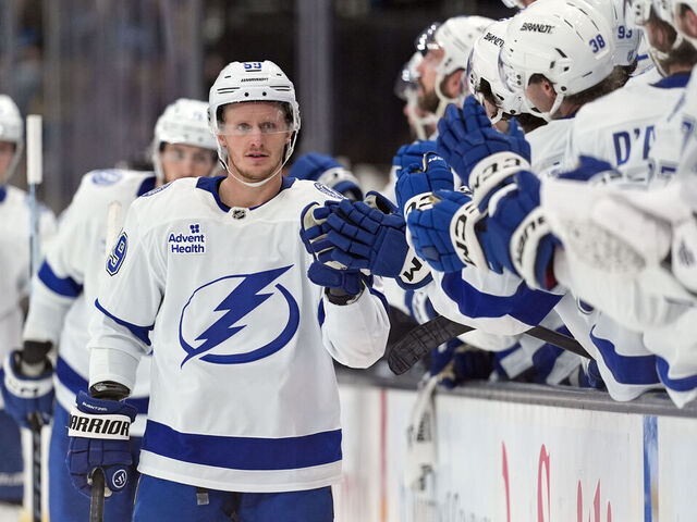 SALT LAKE CITY, UTAH - NOVEMBER 02: Jake Guentzel #59 of the Tampa Bay Lightning high-fives his teammates after scoring a goal in the third period of a game against the Utah Mammoth at Delta Center on November 2, 2025 in Salt Lake City, Utah.