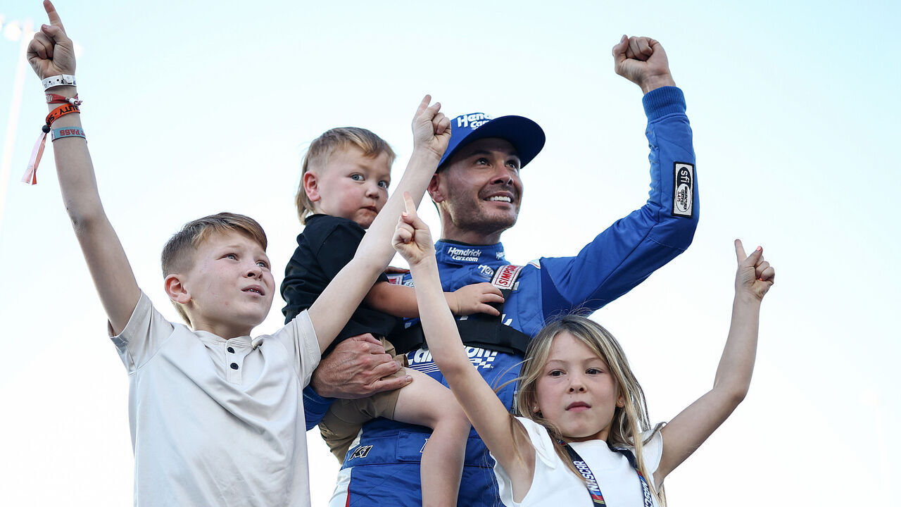 AVONDALE, ARIZONA - NOVEMBER 02: Kyle Larson, driver of the #5 HendrickCars.com Chevrolet, celebrates with sons, Cooper Larson and Owen Larson and daughter Audrey Larson after finish first of the NASCAR Cup Series Championship 4 drivers to win the NASCAR Cup Series Championship at Phoenix Raceway on November 02, 2025 in Avondale, Arizona.