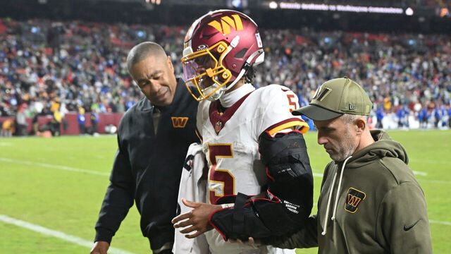 LANDOVER, MARYLAND - NOVEMBER 02: Jayden Daniels #5 of the Washington Commanders walks to the locker room after injuring his left arm during the fourth quarter against the Seattle Seahawks in the game at Northwest Stadium on November 02, 2025 in Landover, Maryland.