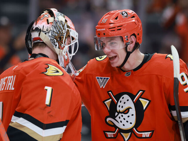 ANAHEIM, CALIFORNIA - NOVEMBER 02: Pavel Mintyukov #98 of the Anaheim Ducks hugs teammate Lukas Dostal #1 after the 3-1 victory over the New Jersey Devils at Honda Center on November 02, 2025 in Anaheim, California.