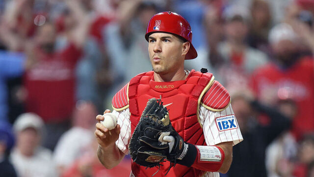 PHILADELPHIA, PENNSYLVANIA - OCTOBER 06: J.T. Realmuto #10 of the Philadelphia Phillies reacts after a run by Teoscar Hernandez #37 of the Los Angeles Dodgers during the seventh inning in game two of the National League Division Series at Citizens Bank Park on October 06, 2025 in Philadelphia, Pennsylvania.