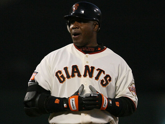 Barry Bonds claps after reaching second base on a 3rd inning double. ; GIANTS V. CUBS at ATT&T PARK. ; Photo: Mark Costantini / S.F. Chronicle ; ; ; Ran on: 12-01-2007 ; ; Ran on: 12-01-2007