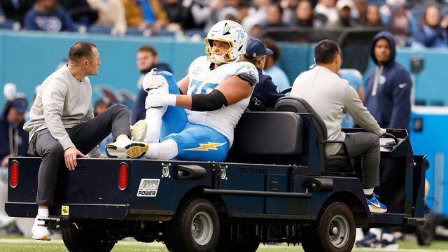 NASHVILLE, TENNESSEE - NOVEMBER 02: Joe Alt #76 of the Los Angeles Chargers leaves the field with an apparent injury in the second quarter against the Tennessee Titans i in the game at Nissan Stadium on November 02, 2025 in Nashville, Tennessee.
