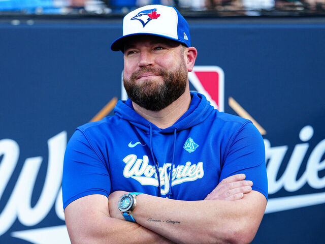 LOS ANGELES, CA - OCTOBER 27: Manager John Schneider #14 of the Toronto Blue Jays looks on prior to Game Three of the 2025 World Series presented by Capital One between the Toronto Blue Jays and the Los Angeles Dodgers at Dodger Stadium on Monday, October 27, 2025 in Los Angeles, California.