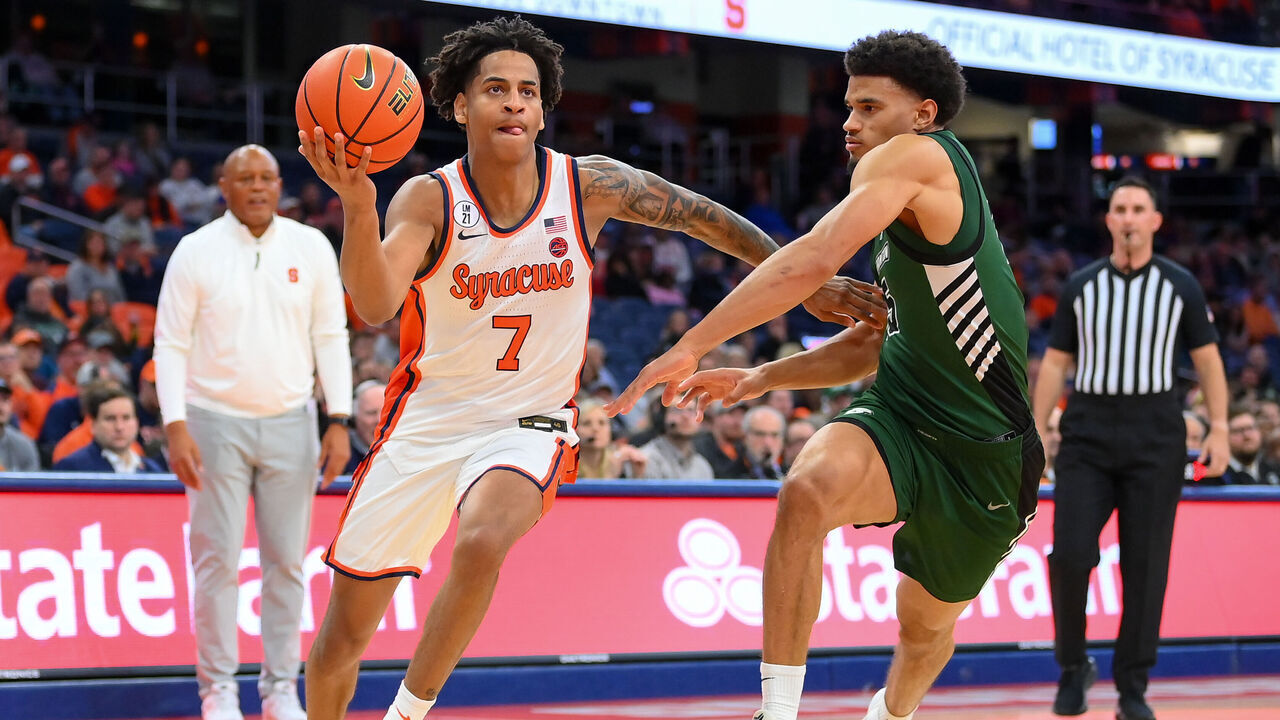 SYRACUSE, NEW YORK - NOVEMBER 3: Kiyan Anthony #7 of the Syracuse Orange drives against Bryson Wilson #15 of the Binghamton Bearcats during the second half at the JMA Wireless Dome on November 3, 2025 in Syracuse, New York. Syracuse won 85-47.