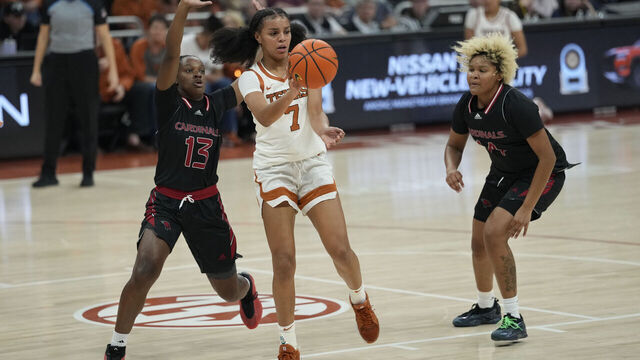 AUSTIN, TEXAS - NOVEMBER 3: Jordan Lee #7 of the Texas Longhorns passes the ball while defended by Madison Williams #13 and Gwendolyn McGrew #14 of the Incarnate Word Cardinals during the second half at Moody Center on November 3, 2025 in Austin, Texas.
