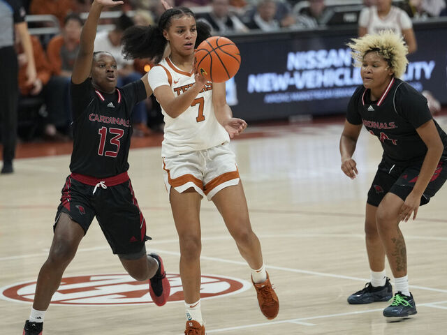 AUSTIN, TEXAS - NOVEMBER 3: Jordan Lee #7 of the Texas Longhorns passes the ball while defended by Madison Williams #13 and Gwendolyn McGrew #14 of the Incarnate Word Cardinals during the second half at Moody Center on November 3, 2025 in Austin, Texas.