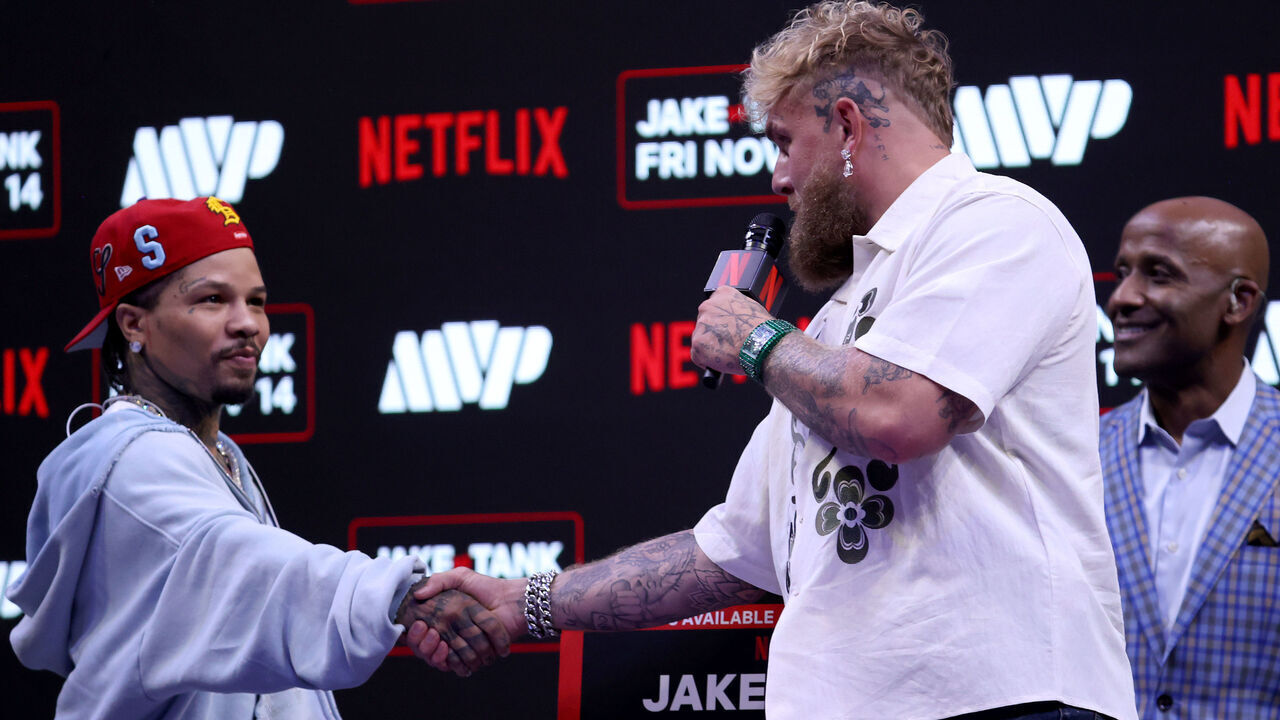 MIAMI, FLORIDA - SEPTEMBER 23: Gervonta "Tank" Davis and Jake Paul shake hands at news conference for their exhibition match scheduled for November 14 at Kaseya Center on September 23, 2025 in Miami, Florida.