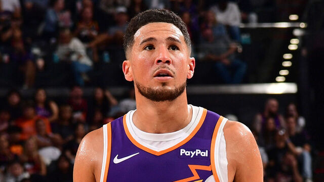 PHOENIX, AZ - OCTOBER 22: Devin Booker #1 of the Phoenix Suns looks on during the game against the Sacramento Kings on October 22, 2025 at PHX Arena in Phoenix, Arizona. Mandatory Copyright Notice: Copyright 2025 NBAE