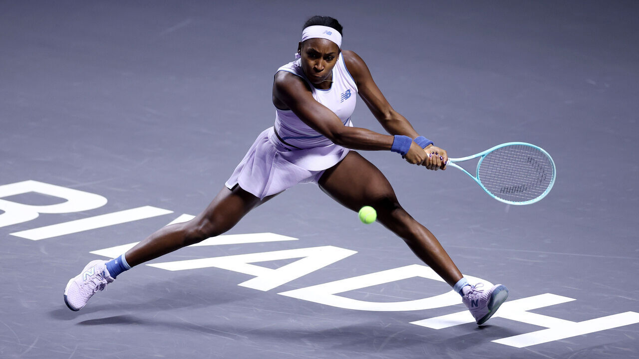 RIYADH, SAUDI ARABIA - NOVEMBER 04: Coco Gauff of United States plays a backhand against Jasmine Paolini of Italy during their Round Robin Singles match on day four of the WTA Finals Riyadh as part of the Hologic WTA Tour 2025 at King Saud University Indoor Arena on November 04, 2025 in Riyadh, Saudi Arabia.